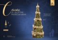 Choinka LED 10 metrów z realistycznym igliwiem ozdobiona trzema dużymi złotymi pierścieniami i gęsto rozmieszczonymi migoczącymi diodami, ustawiona na tle szkicu galerii handlowej z sylwetkami przechodniów.
