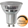 Żarówka LED GU10 z przezroczystym reflektorem i oznaczeniem dimmer compatible.