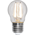 Żarówka LED E27 A60 z włączonymi filamentami emitującymi ciepłe białe światło, przezroczysta bańka i srebrny gwint.