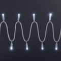 Sznur światełek LED o zimnobiałej barwie, ułożony falami na ciemnym tle, z równomiernie rozmieszczonymi punktami świetlnymi skierowanymi w górę i dół.
