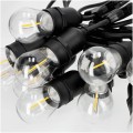 Zbliżenie na czarne oprawki E27 girlandy BAJA z przezroczystymi żarówkami LED typu filament.