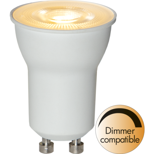 Żarówka LED GU10 z białą obudową, świecąca ciepłym światłem, oznaczenie dimmer compatible.