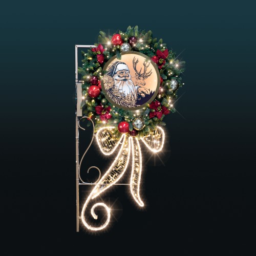 Dekoracja latarniowa LED 2D Wieniec z Mikołajem – ozdoba z naturalnie wyglądającym igliwiem, nietłukącymi bombkami i podświetlanym kasetonem z wizerunkiem Świętego Mikołaja i renifera.