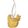 Porcelanowa dekoracja wielkanocna LED w kształcie żółtego kurczaczka z ażurowymi wycięciami i białą wstążką do zawieszenia, emitująca ciepłe, nastrojowe światło.