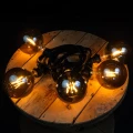 Zestaw girlandy z dużymi żarówkami LED G125 1,8W filament smoke emitującymi ciepłe światło. Stylowe oświetlenie dekoracyjne do ogrodu, restauracji i przestrzeni eventowych.