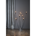 Lampa podłogowa z rozgałęzionymi ramionami i żarówkami LED E14 T26 na drewnianej podłodze.