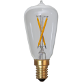 Dekoracyjna żarówka LED filament w kształcie Edison z przezroczystą bańką i skrzyżowanymi filamentami na jasnym tle, gwint E14.
