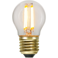 Dekoracyjna żarówka LED filament E27 z przezroczystą kulistą bańką emitująca ciepłe światło. Cztery filamenty LED tworzą stylowy efekt retro w lampach dekoracyjnych.