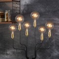 Dekoracyjna lampa stołowa z kilkoma żarówkami LED na czarnej konstrukcji z mosiężnymi oprawkami. Ciepłe światło tworzy elegancki, przytulny klimat wnętrza.