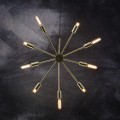 Lampa wisząca PIX o średnicy 50 cm w kolorze mosiądzu, z promieniście rozchodzącymi się ramionami zakończonymi świecącymi żarówkami.