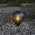 Lampa ogrodowa ORBY z kulistym dymionym kloszem, oprawką E27 i stopniem ochrony IP44.