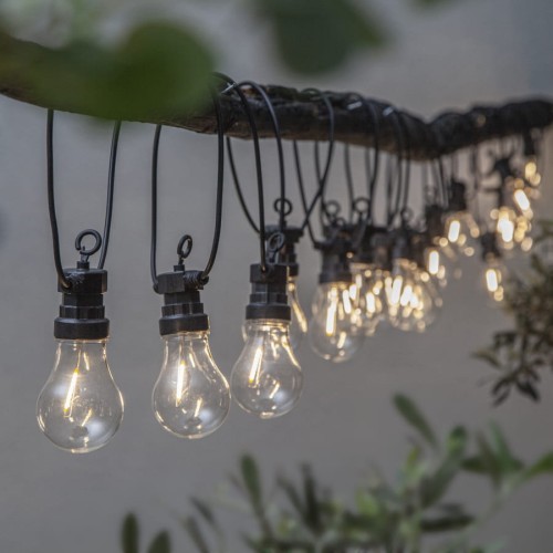 Girlanda ogrodowa LED Circus z lampkami filament zawieszona na gałęzi, ciepłe białe światło dekoracyjne do tarasu i ogrodu.