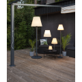 Lampa ogrodowa stojąca KRETA o wysokości 150 cm, z czarną smukłą podstawą i białym kloszem w kształcie ściętego stożka.