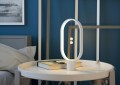 Lampa stołowa LED HENG Balance Ellipse 3W z owalną drewnianą konstrukcją i magnetycznym elementem pośrodku.