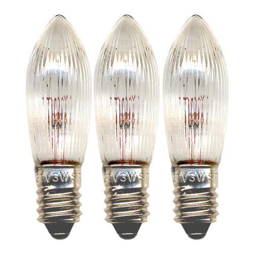 Zestaw trzech żarówek LED E10 w kształcie świeczki z ryflowanym, przezroczystym kloszem. Widoczne filamenty LED i metalowe gwinty. Produkt na czarnym tle, przeznaczony do świeczników i dekoracji świetlnych.