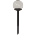 Solarny słupek ogrodowy LED z przezroczystą kulą i czarną obudową, lampa wbijana do gruntu z widocznym źródłem światła, dekoracyjne oświetlenie zewnętrzne do rabat i ogrodu.