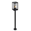 Lampa ogrodowa stojąca ALAMONTE 1 z wysokim czarnym słupkiem i prostokątną, przeszkloną oprawą.