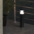 Lampa ogrodowa stojąca LED BASALGO-Z z czarnym cylindrycznym korpusem i jasną częścią świetlną u góry.