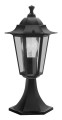 Lampa ogrodowa stojąca LATERNA 4 z czarną ozdobną podstawą i przeszklonym kloszem w formie latarni.