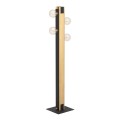 Lampa podłogowa LAYHAM z pionowym drewnianym elementem, czarną metalową konstrukcją i czterema dekoracyjnymi żarówkami.