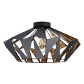 Geometryczna lampa sufitowa CARLTON 6 z ażurowym metalowym kloszem w czarnym kolorze oraz kontrastującymi miedzianymi powierzchniami wewnątrz.