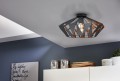 W jasnej aranżacji lampa sufitowa CARLTON 6 wyróżnia się czarną geometryczną konstrukcją klosza z miedzianymi detalami.