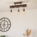 Lampa sufitowa TOWNSHEND 4 w kolorze antycznego brązu, z czterema odsłoniętymi żarówkami zawieszonymi pod metalową belką.