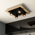 Lampa sufitowa LED VALCASOTTO 1 z czterema czarnymi reflektorami GU10, zamontowana na kwadratowej płycie z jasnym drewnianym wykończeniem.