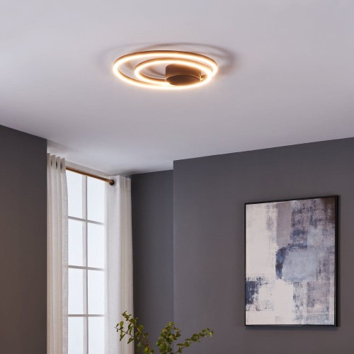 Lampa sufitowa LED RUOTALE 36W o nowoczesnej formie dwóch nachodzących na siebie pierścieni, emitująca ciepłe białe światło 3000K.