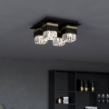 Lampa sufitowa BARRANCAS z czarną kwadratową podstawą, złotymi detalami i czterema przezroczystymi kryształowymi kloszami.