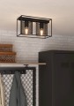 W jasnym wnętrzu lampa sufitowa CATTERICK tworzy geometryczny akcent dzięki czarnej ramie i trzem cylindrycznym kloszom.