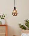 W jasnym wnętrzu lampa ADWICKLE zawieszona przy ścianie wyróżnia się stożkowym kloszem z naturalnej tkaniny i czarnym przewodem.