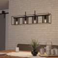 Lampa wisząca CATTERICK z czarną metalową konstrukcją i pięcioma punktami świetlnymi, zawieszona nad stołem w nowoczesnym wnętrzu.