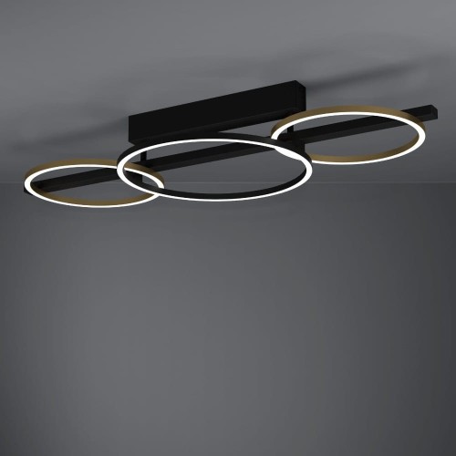 Lampa sufitowa LED LANACERA z trzema owalnymi pierścieniami świetlnymi, zamontowana na suficie i emitująca ciepłe białe światło 3000K.