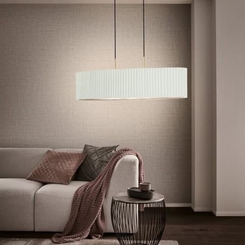 Lampa wisząca TAMARESCO z podłużnym białym aksamitnym kloszem i złotymi detalami, zawieszona nad stolikiem w eleganckim salonie.