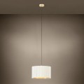 Lampa wisząca TAMARESCO z pojedynczym białym aksamitnym kloszem, zawieszona na tle ciemnej ściany i emitująca delikatne światło.