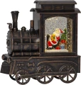 Dekoracyjna lokomotywa świąteczna wodna LED w kolorze postarzanego brązu, z Mikołajem siedzącym przy choince i prezentach w brokatowym „śniegu”, przedstawiona na białym tle jako ozdoba bożonarodzeniowa.
