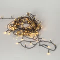 Lampki choinkowe LED 100 diod 7 m, ciepłe białe światło 1900K FLASHY, przewód czarny, dekoracja świetlna do wnętrz i na zewnątrz.