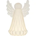 Biała ceramiczna dekoracja LED w formie anioła, świecąca ciepłym światłem; widok frontowy na jednolitym tle, widoczna struktura powierzchni i łagodna barwa światła.
