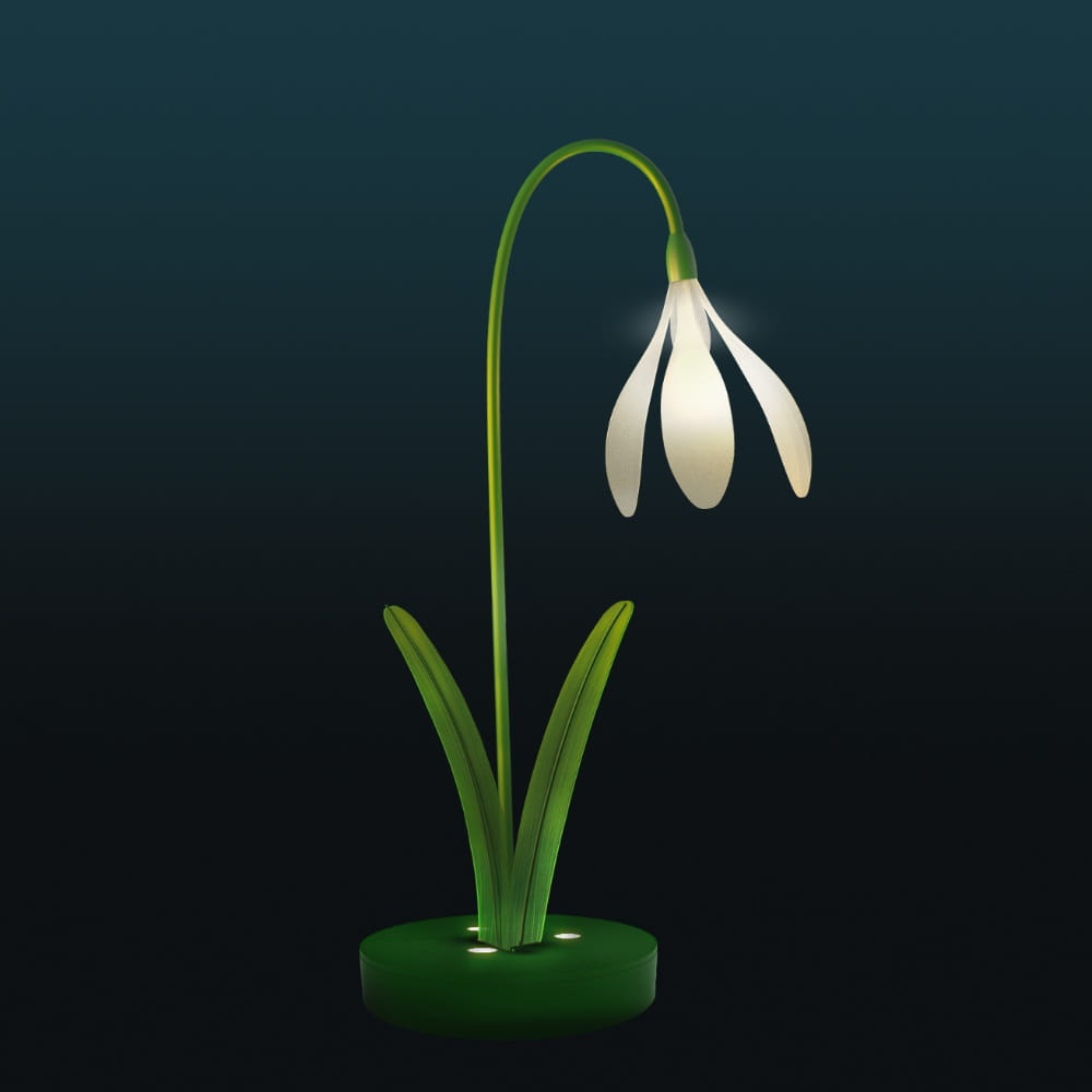 Dekoracja świetlna LED w formie przebiśniegu na ciemnym tle, nowoczesny element 3D z delikatnym podświetleniem płatków i zielonej łodygi, przeznaczony do parków, alejek i przestrzeni miejskich oraz instalacji plenerowych.