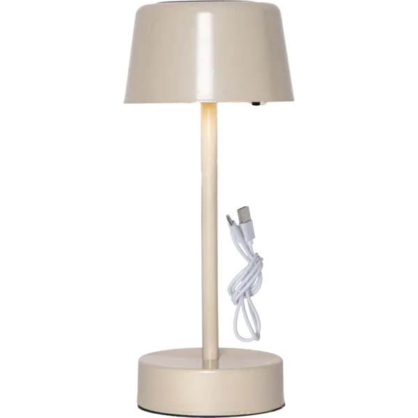 Beżowa solarna lampa stołowa LED na białym tle z przewodem USB do ładowania.