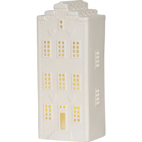 Biała ceramiczna dekoracja w formie domku z podświetlanymi oknami; widok frontowy na jednolitym tle, wyraźne detale fasady i ciepłe światło wewnątrz.